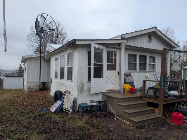 20776 Tennis Rd, Hillman, MI 49746 - rear view of house with a deck