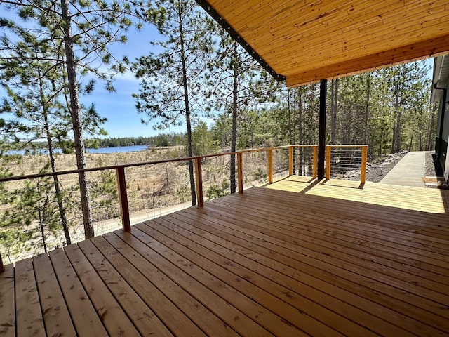 wooden deck featuring a water view