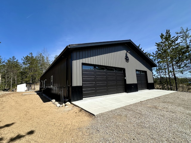 view of side of home with an outbuilding and a detached garage