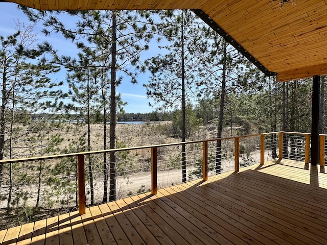 wooden deck featuring a water view