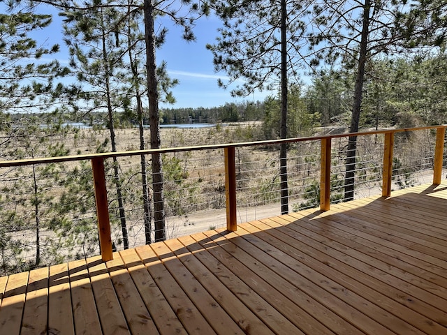 wooden deck with a water view