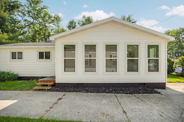 12320 E Houghton Lake Dr, Houghton Lake, MI 48629 - back of property featuring crawl space