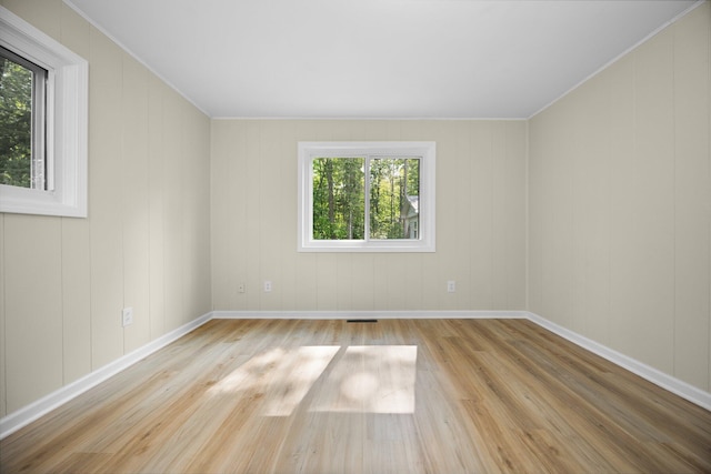 12320 E Houghton Lake Dr, Houghton Lake, MI 48629 - unfurnished room with wood finished floors and ornamental molding