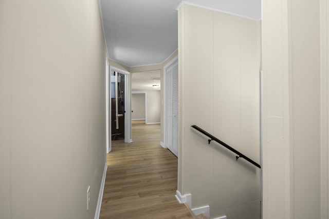 12320 E Houghton Lake Dr, Houghton Lake, MI 48629 - corridor with an upstairs landing and wood finished floors