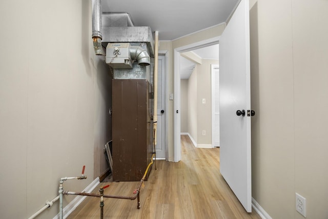12320 E Houghton Lake Dr, Houghton Lake, MI 48629 - hallway with light wood-type flooring and crown molding