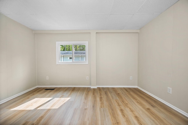 12320 E Houghton Lake Dr, Houghton Lake, MI 48629 - spare room with light wood-style flooring and baseboards