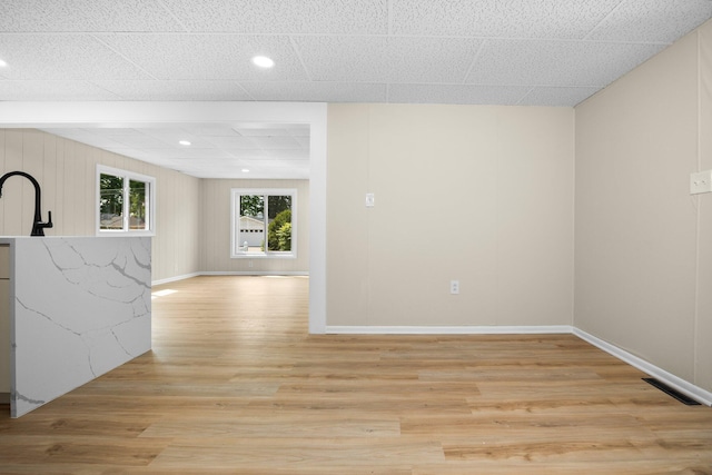 12320 E Houghton Lake Dr, Houghton Lake, MI 48629 - empty room with light wood-style floors and recessed lighting