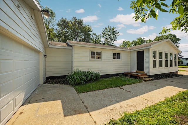 12320 E Houghton Lake Dr, Houghton Lake, MI 48629 - view of front of house with crawl space and concrete driveway