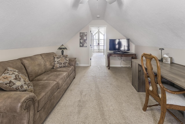 6150 Northpoint Dr, Saint Helen, MI 48656 - living area featuring a ceiling fan, a textured ceiling, vaulted ceiling, and carpet floors
