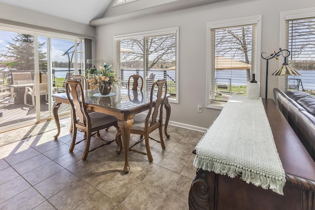 6150 Northpoint Dr, Saint Helen, MI 48656 - tiled dining space featuring lofted ceiling and a water view