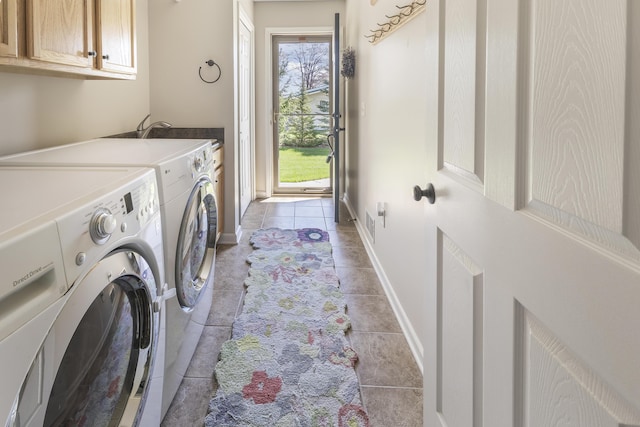 6150 Northpoint Dr, Saint Helen, MI 48656 - laundry room featuring cabinet space, washer and clothes dryer, and light tile patterned floors