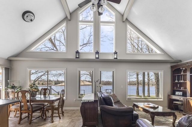 6150 Northpoint Dr, Saint Helen, MI 48656 - living room with a ceiling fan, high vaulted ceiling, a water view, and light tile patterned flooring