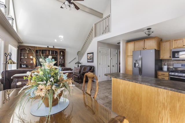 6150 Northpoint Dr, Saint Helen, MI 48656 - dining room with ceiling fan, high vaulted ceiling, stairs, and beamed ceiling