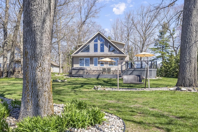 6150 Northpoint Dr, Saint Helen, MI 48656 - rear view of property with a hot tub, a lawn, and a deck