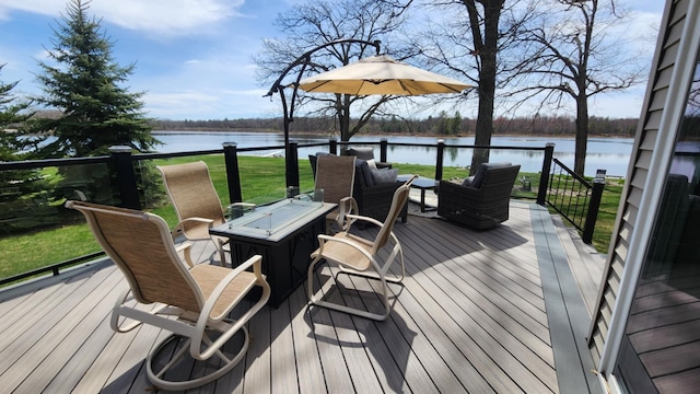 6150 Northpoint Dr, Saint Helen, MI 48656 - deck featuring a water view, an outdoor fire pit, and a lawn