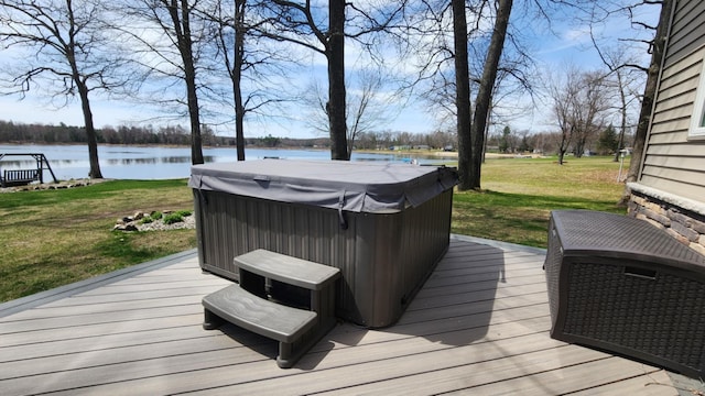 6150 Northpoint Dr, Saint Helen, MI 48656 - wooden deck featuring a hot tub, a water view, and a lawn