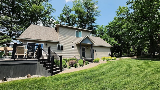 6150 Northpoint Dr, Saint Helen, MI 48656 - view of front of property with a front yard, roof with shingles, and a deck