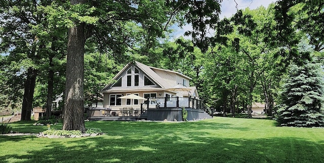 6150 Northpoint Dr, Saint Helen, MI 48656 - rear view of property featuring a deck and a lawn