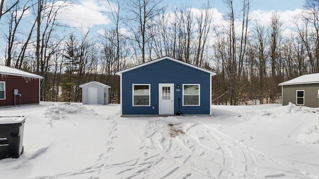 635 Gazelle St, Gaylord, MI 49735 - snow covered structure with an outdoor structure and a storage unit