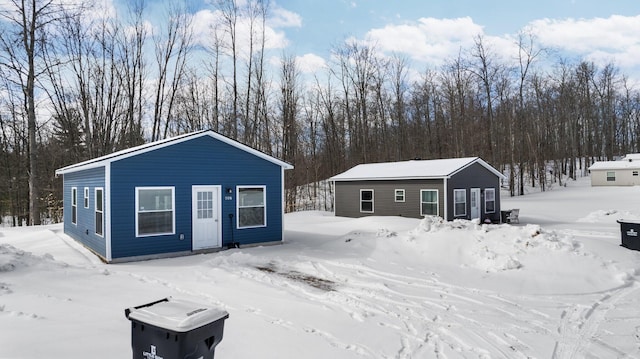 635 Gazelle St, Gaylord, MI 49735 - snow covered structure featuring an outdoor structure