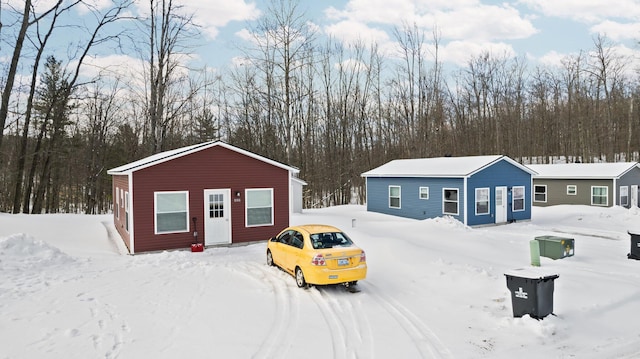635 Gazelle St, Gaylord, MI 49735 - snow covered structure with an outbuilding