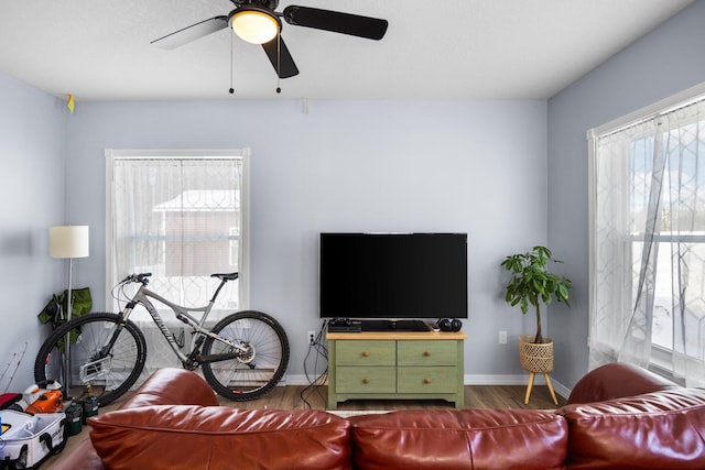635 Gazelle St, Gaylord, MI 49735 - living area featuring ceiling fan, wood finished floors, and baseboards