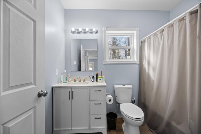 635 Gazelle St, Gaylord, MI 49735 - full bath featuring toilet, vanity, and a shower with shower curtain