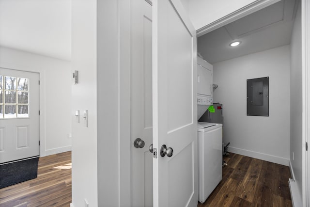 598 Gazelle St, Gaylord, MI 49735 - laundry room with stacked washer and dryer, baseboards, electric panel, and dark wood-style floors