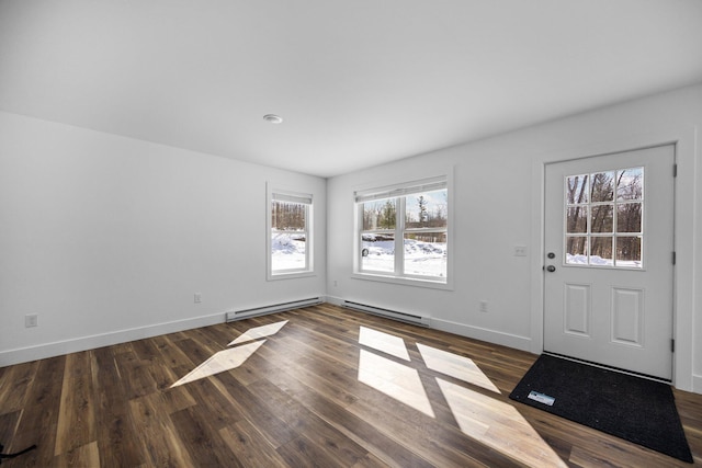 598 Gazelle St, Gaylord, MI 49735 - foyer entrance featuring a baseboard radiator, baseboards, and dark wood-style floors