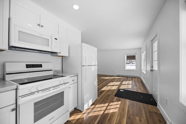 598 Gazelle St, Gaylord, MI 49735 - kitchen with white appliances, dark wood-type flooring, white cabinets, light countertops, and baseboards