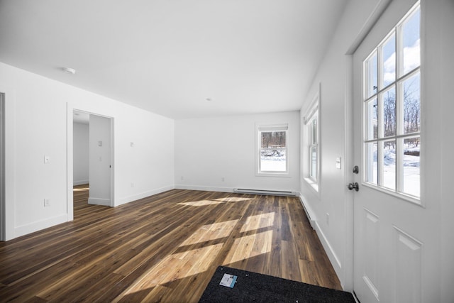 598 Gazelle St, Gaylord, MI 49735 - interior space with baseboards, plenty of natural light, and dark wood finished floors