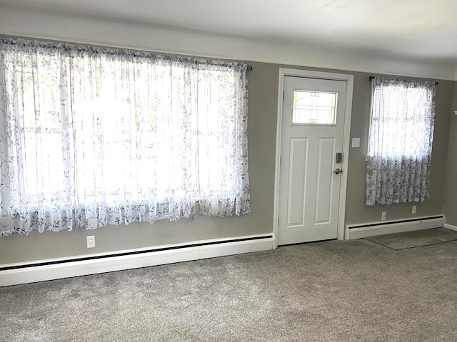 entrance foyer featuring carpet and baseboard heating