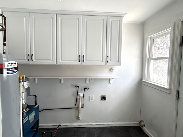 laundry room with electric dryer hookup, baseboards, gas water heater, washer hookup, and cabinet space