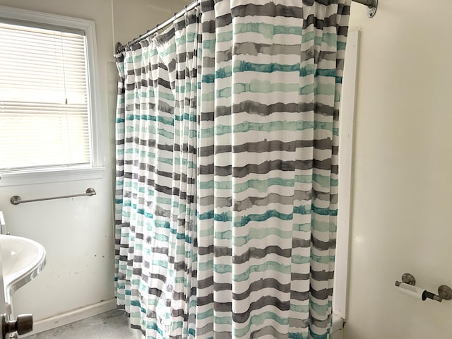 bathroom with a shower with curtain