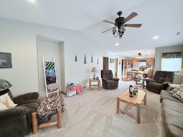 carpeted living room featuring visible vents, a ceiling fan, baseboards, recessed lighting, and vaulted ceiling