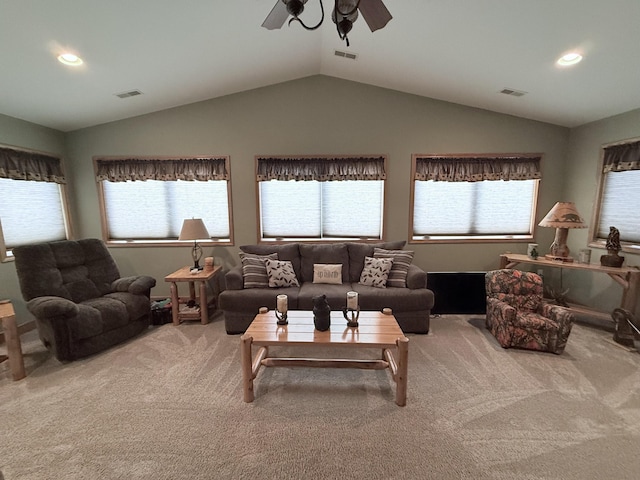 carpeted living room with visible vents, a ceiling fan, and lofted ceiling