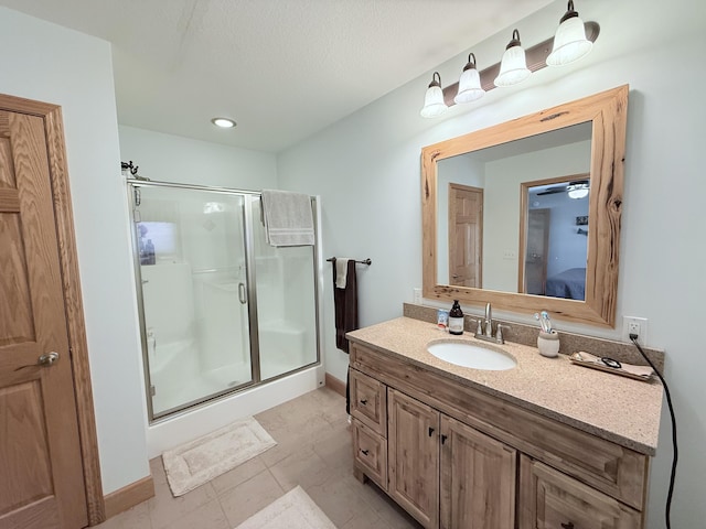 bathroom featuring a shower stall, vanity, baseboards, ensuite bathroom, and recessed lighting