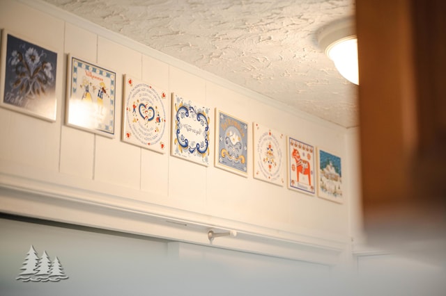 room details with a textured ceiling and ornamental molding