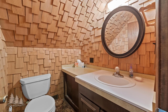 bathroom with toilet and vanity