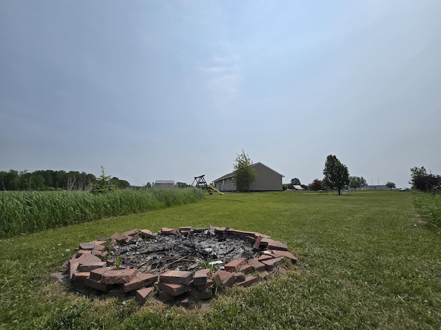 626 W Finerty Rd, West Branch, MI 48661 - view of green lawn featuring a fire pit