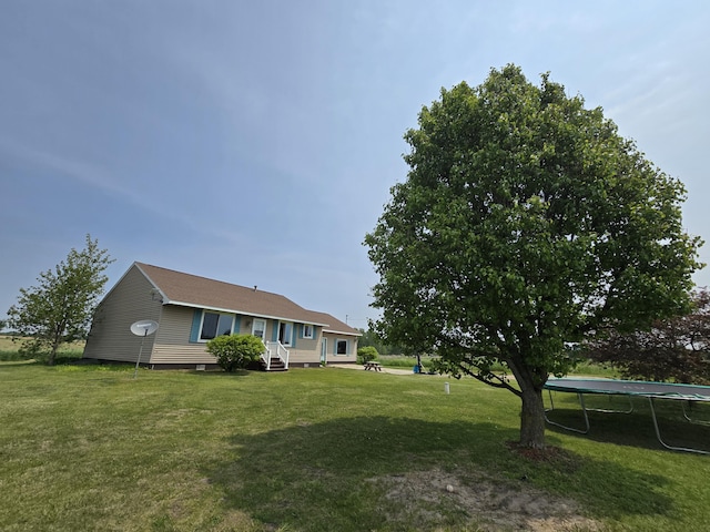 626 W Finerty Rd, West Branch, MI 48661 - view of front of house with a trampoline and a front lawn