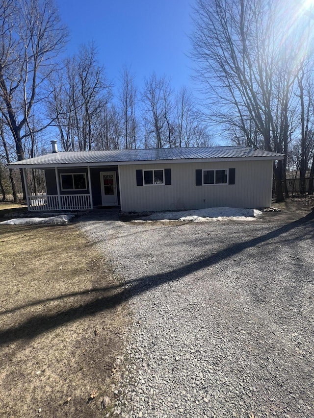 view of front of house with metal roof and covered porch