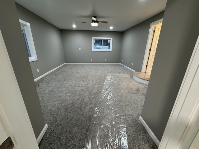 carpeted empty room with ceiling fan, baseboards, and recessed lighting
