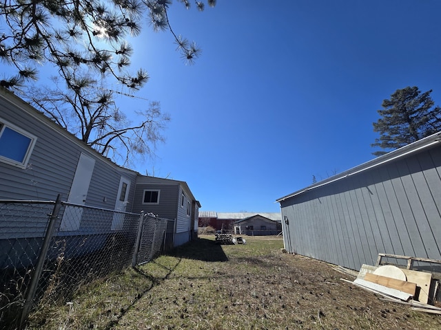 2051 Stutesman Dr, Fairview, MI 48621 - view of yard with fence