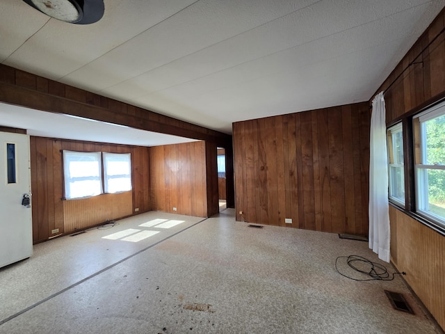 2051 Stutesman Dr, Fairview, MI 48621 - unfurnished room with wood walls