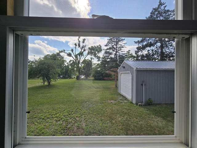 2051 Stutesman Dr, Fairview, MI 48621 - view of grassy yard with an outbuilding