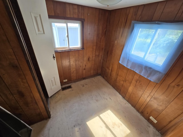 2051 Stutesman Dr, Fairview, MI 48621 - empty room with wood walls