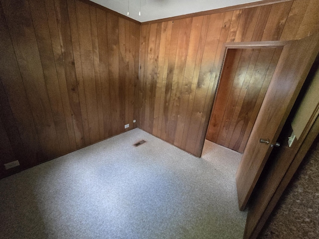 2051 Stutesman Dr, Fairview, MI 48621 - empty room with wooden walls