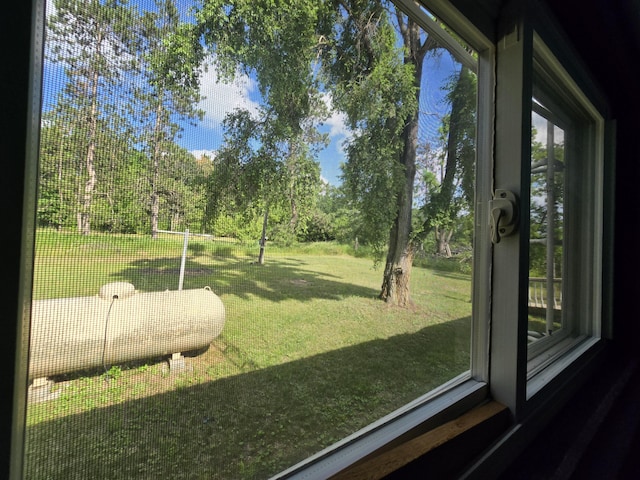 2051 Stutesman Dr, Fairview, MI 48621 - sunroom featuring view of scattered trees