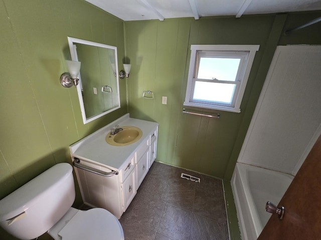2051 Stutesman Dr, Fairview, MI 48621 - bathroom with vanity, a decorative wall, and tile patterned floors